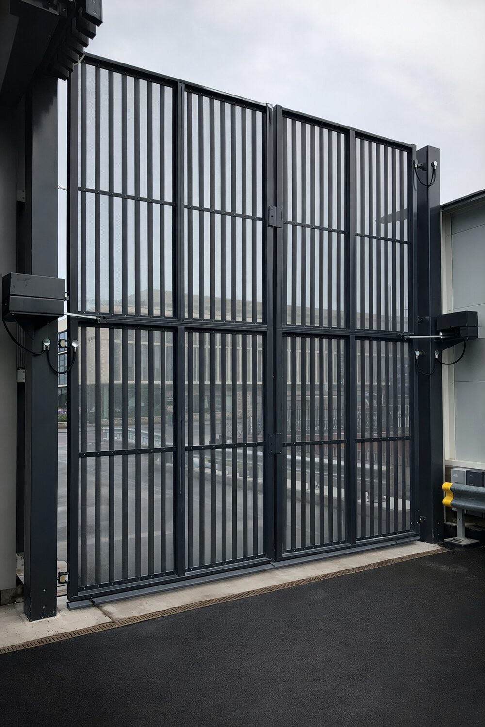 Large tall black automated gate